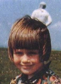 Elizabeth Templeton outdoors with a pale background figure in the 1964 photograph
